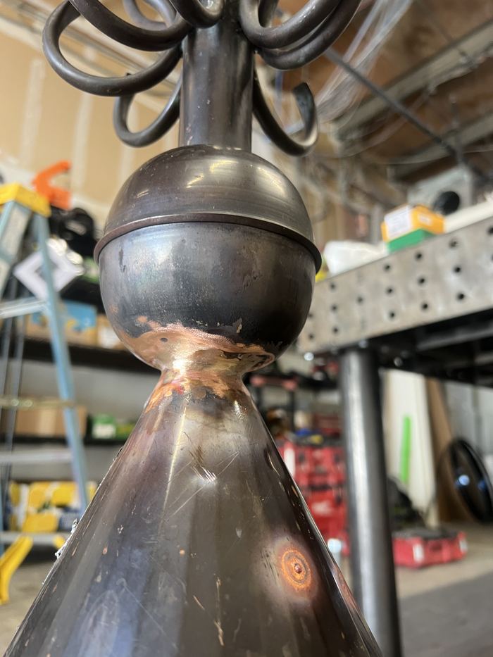 Close view of the spire's ball and scrolls